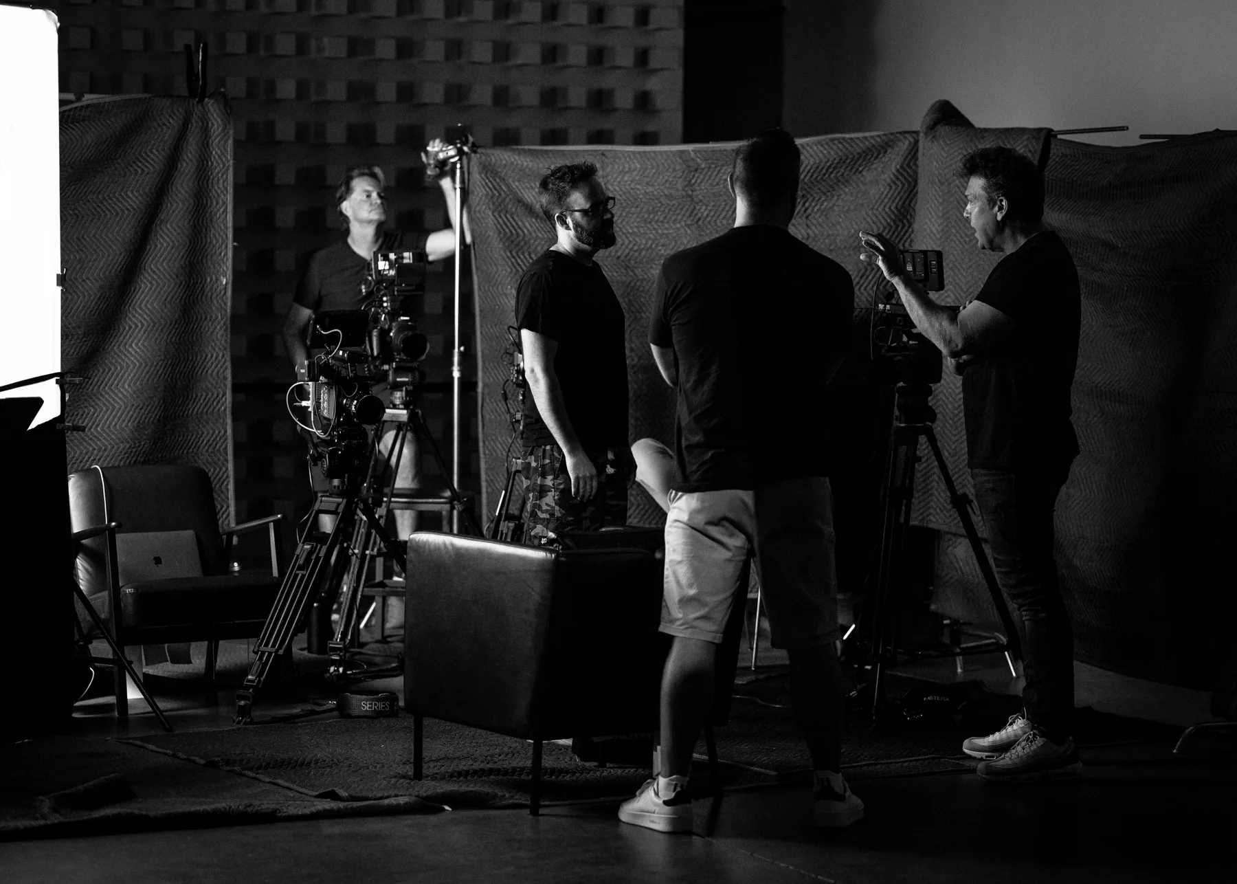 Score G crew filming an interview on set